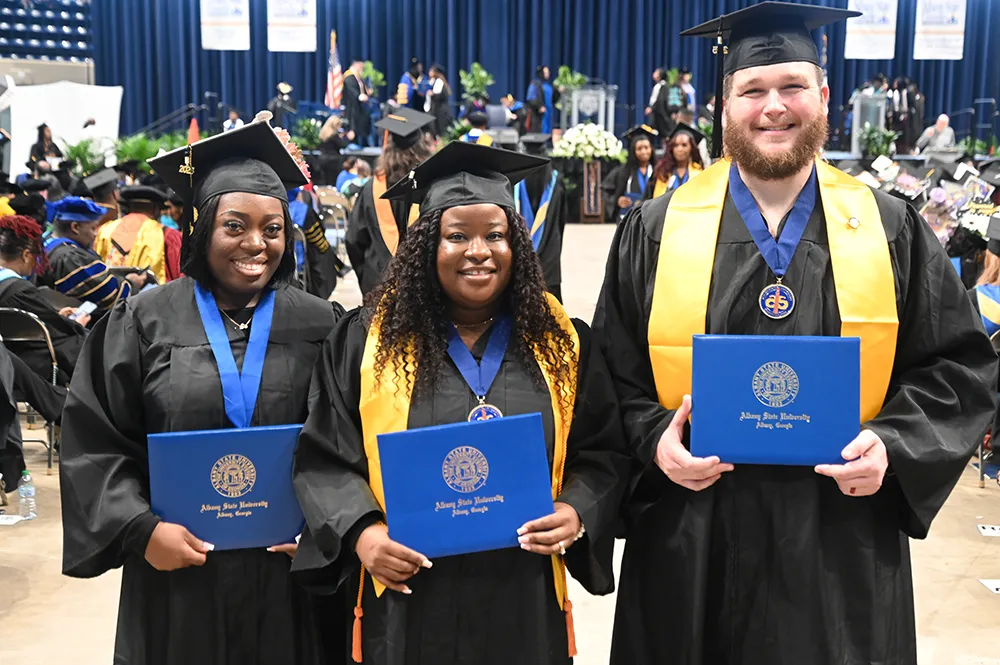 ASU graduates in cap and gown