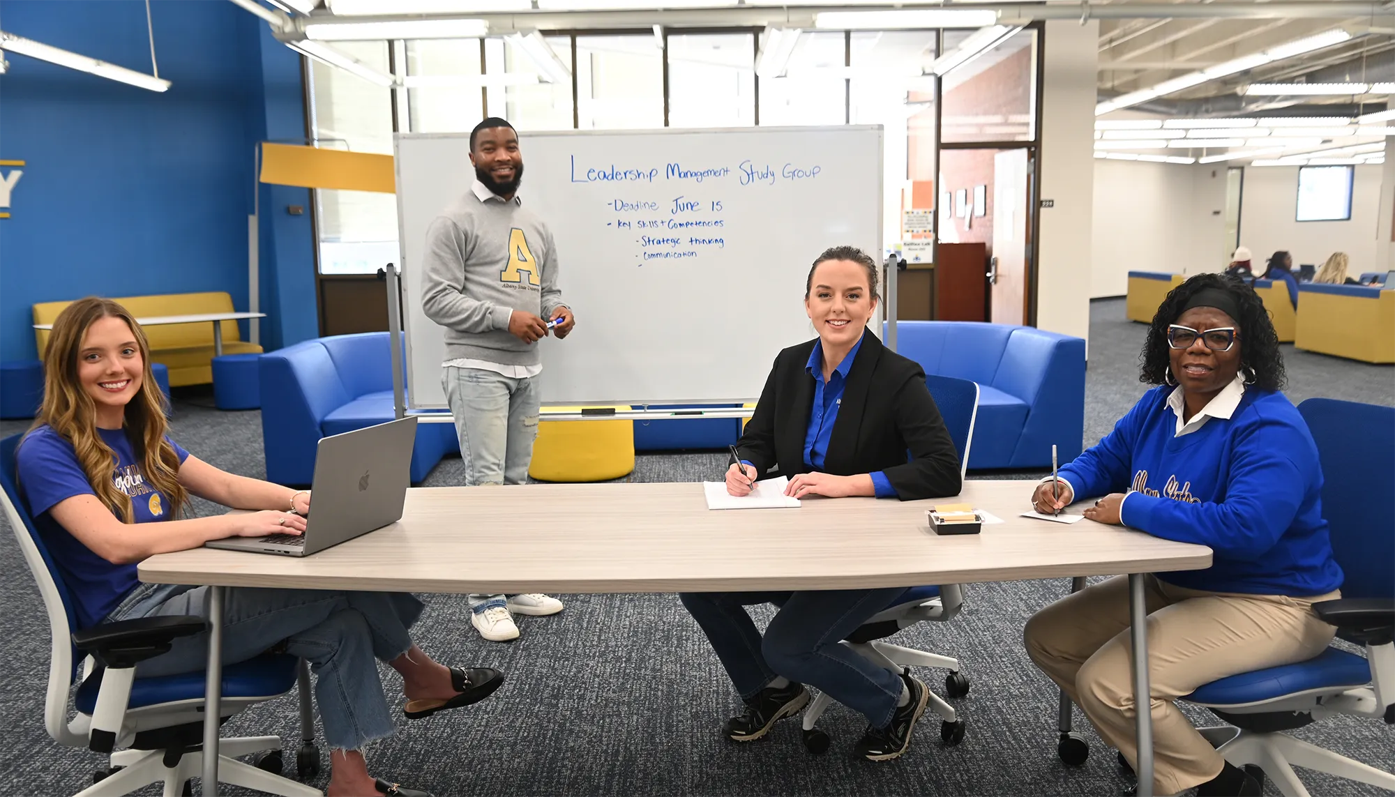 ASU students and professor smiling