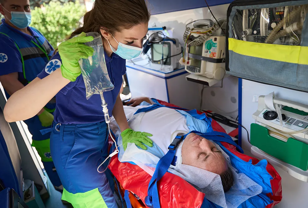 Paramedic Student administering IV Fluids